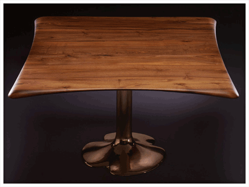 table with walnut top and base in cast gold
